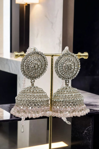 Silver Tabiha Jhumka Earrings with pink crystal fringe, part of the handcrafted Pakistani jewelry set for ethnic wear.