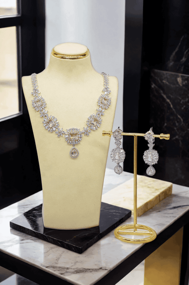 Abi Diamante Floral Necklace Set - AD CZ Necklace Set with intricate floral design, featuring a stunning aqua blue teardrop center stone, perfect for any occasion.