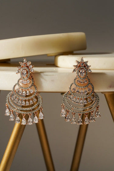 Pair of rose gold chandelier earrings with dazzling AD stones, designed for minimalist yet festive fashion statements.