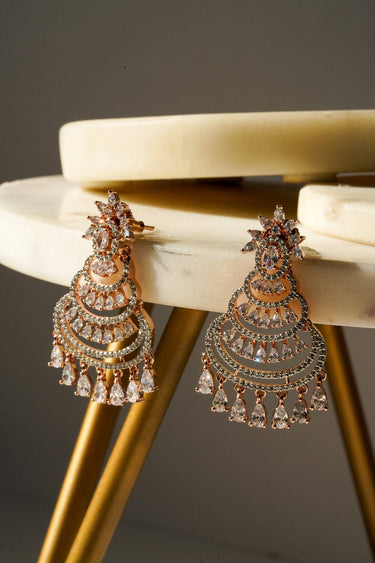 Rose gold sparkling chandelier earrings with AD stones and intricate detailing, ideal for elegant accessory styling.
