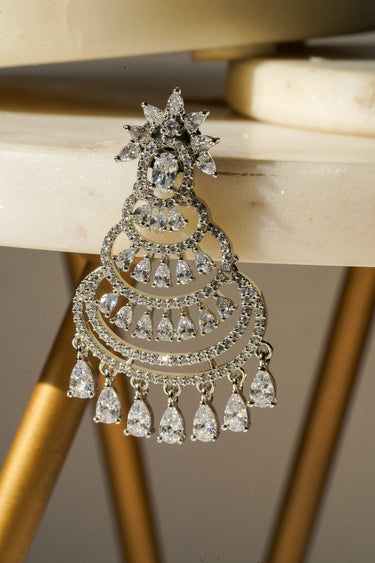 Close-up of Mim dainty sparkling chandbali chandelier earring in rhodium, featuring layered arches and CZ stones.