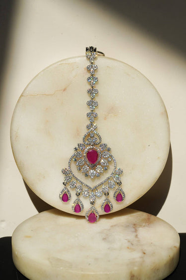 Oversized Rhodium plated American Diamond Maang Tikka with ruby pink and green teardrop dangles