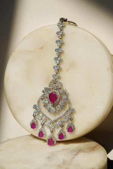Oversized Rhodium plated American Diamond Maang Tikka with ruby pink and green teardrop dangles