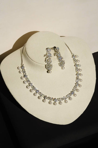 Aditi Flora Pearl & Diamante Necklace Set on display bust