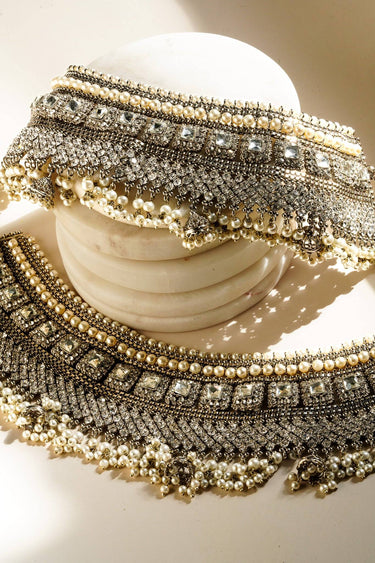 Soha artisan crafted bridal statement ankle set for Desi brides in silver and pearl with white stones