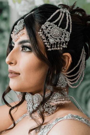 Namar Silver Plated AD Indian Choker Necklace Set worn by model, featuring white CZ stones and light pink beads in a bridal look.