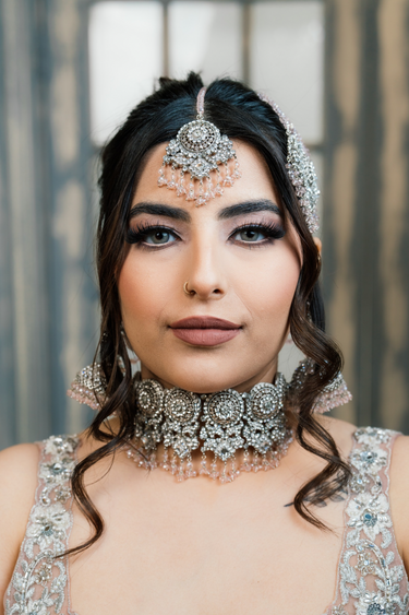 Front view of Namar Silver Plated AD Indian Choker Necklace Set with intricate CZ stonework and pink bead accents, styled for weddings.