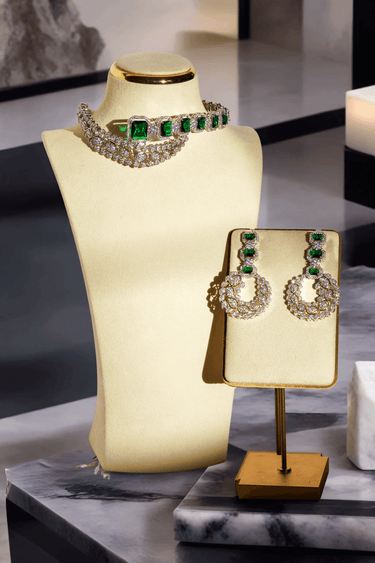 Ashma Bridal Set - Multilayer rhodium-plated silver finish with emerald green stones, including choker and multi-layered necklace.