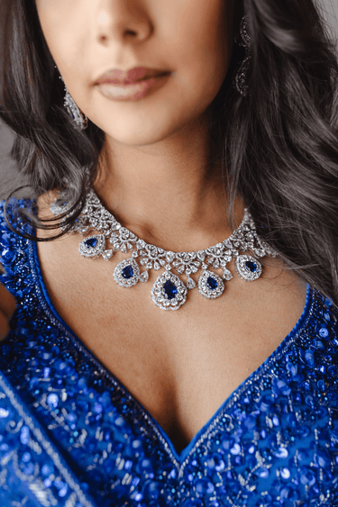 Close-up of Purvi Diamante Necklace Set - Bridal Indian Jewelry in blue, showcasing intricate detailing and sparkling stones for bridal elegance.