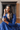 Model seated in blue lehenga wearing Purvi Diamante Necklace Set - Bridal Indian Jewelry, styled for traditional Indian bridal fashion.