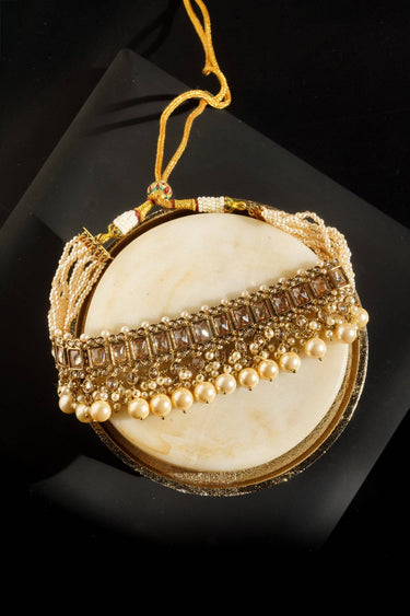 Maha Antique Gold Choker Necklace Set displayed on a round surface