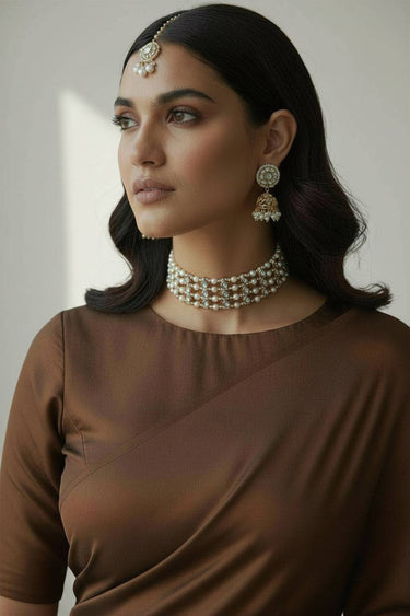 Model wearing Inaury Manisha Pearl Choker Necklace Set — gold-plated statement choker necklace set with earrings and pearl drops for desi wedding jewelry