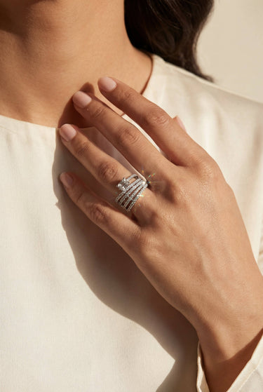 Model wearing the Inaury Nina multirow adjustable AD ring in rhodium plating with white diamante stones and cushion cut center stone – South Asian jewelry