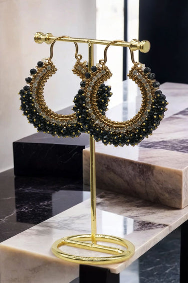 Noor Chandbali Hoop Earrings in gold-tone with black beads, offering bold South Asian elegance for statement looks.