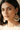 Woman wearing large, ornate Pakistani earrings with intricate designs.