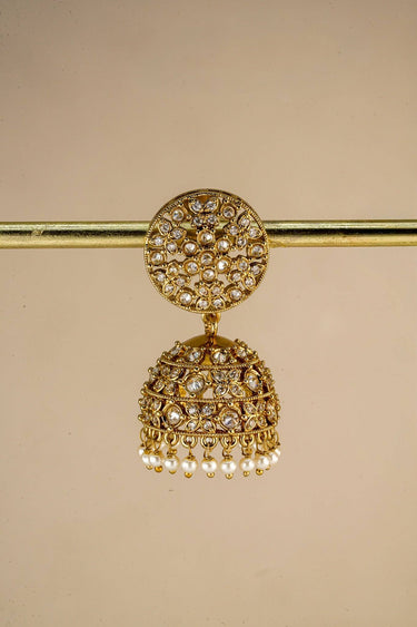 Back view of gold Jhumka earrings with secure screw-on backs, highlighting the detailed craftsmanship and design.
