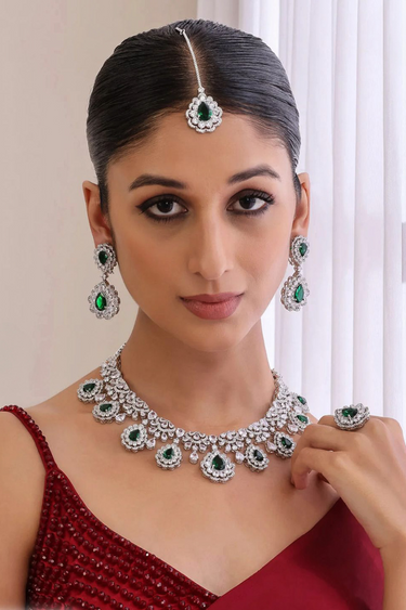 Model wearing green Purvi Diamante Necklace Set - Bridal Indian Jewelry with matching earrings and maang tikka, styled for traditional weddings.