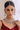 Model wearing green Purvi Diamante Necklace Set - Bridal Indian Jewelry with matching earrings and maang tikka, styled for traditional weddings.
