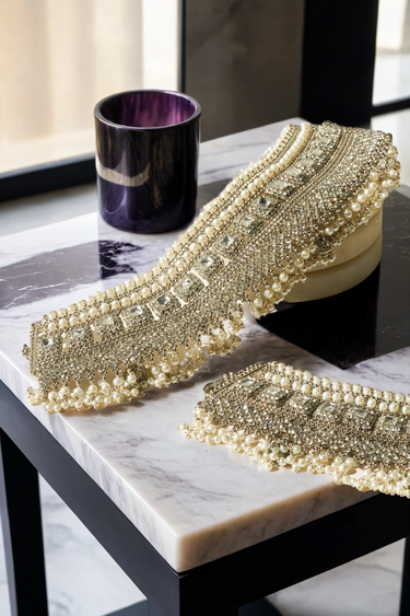 Soha artisan crafted bridal statement ankle set for Desi brides in silver and pearl with white stones
