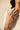 Hand wearing a silver-toned adjustable baguette diamante statement ring with mint green center stone - South Asian jewelry - Inaur