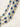 Amisha Triple Layer Diamante Accent AD Necklace Set in gold or rhodium-plated silver finish with color options of silver & sapphire blue, silver & green, gold & green, and silver & ruby, featuring floral and cushion cut stone patterns with matching earrings.