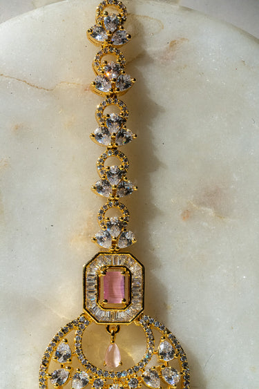 Gold-plated floral maang tikka with American Diamonds in white and pink from Inaury