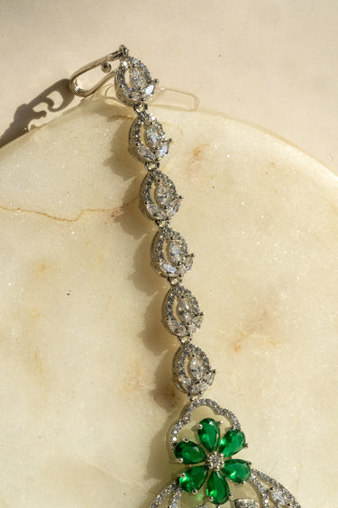 Silver-plated floral maang tikka with AD stones in silver and green from Inaury