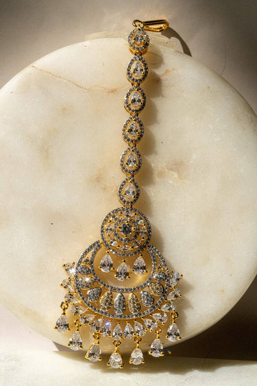 Close Up of Gold-Plated Multicolor AD Maang Tikka with Light Pink and White Stones
