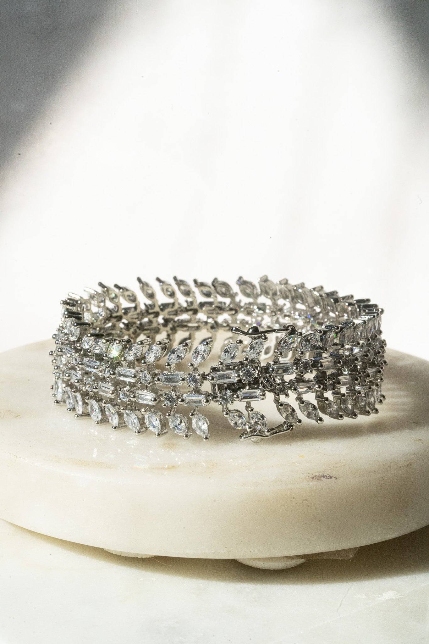 Ariana gold or rhodium plated AD stone bangle bracelet with diamante accents from Inaury