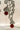 Rhodium plated vine design earrings with diamante stones and resin beads in green or maroon from Inaury