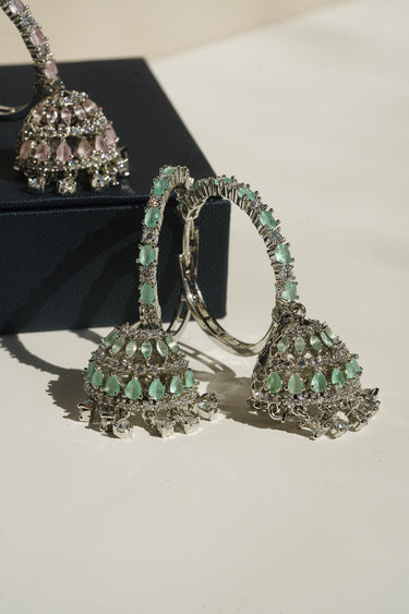 Disha mint green AD hoop jhumka earrings styled pair with blush pink variant in background South Asian festive jewellery