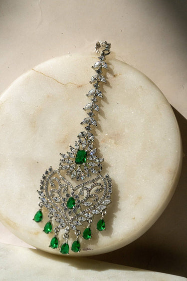 Close-Up of Rhodium-Plated Multicolor AD Maang Tikka with Green and White Stones
