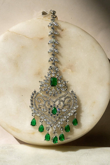 Close-Up of Rhodium-Plated Multicolor AD Maang Tikka with Green and White Stones