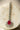 Rhodium-plated maang tikka with matte ruby red teardrop center and white AD stones from Inaury