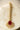 Gold-plated maang tikka with matte ruby red teardrop center and white AD stones from Inaury