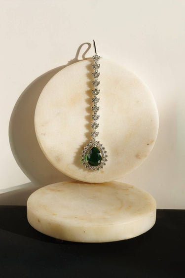 The deep emerald green stone variation of the Amore American Diamond forehead jewelry accessory for women's party wear.