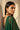 Side profile portrait of a model showcasing the length and detailing of the gold-plated Kavya ruby and emerald chandbali earrings.