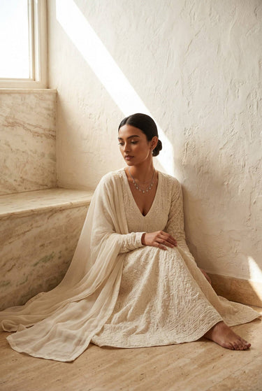 A closer, direct neckline shot of the Sania triple-layer kundan chain necklace draped cleanly across the collarbone on a model.
