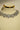 Alternative studio presentation angle of the Shanaya geometric silver-toned choker and earring set positioned under specialized jewelry lighting.