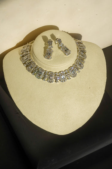 Alternative studio presentation angle of the Shanaya geometric silver-toned choker and earring set positioned under specialized jewelry lighting.