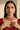 A closer neckline view on a model showing the collarbone contouring drape of the Sweta antique gold-plated red choker set.
