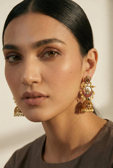 Close-up of Inaury Saaira Kundan Chandbali Jhumka Earrings — gold-plated kundan earrings with ruby-pink stones and jhumka bell drop for desi bridal jewelry