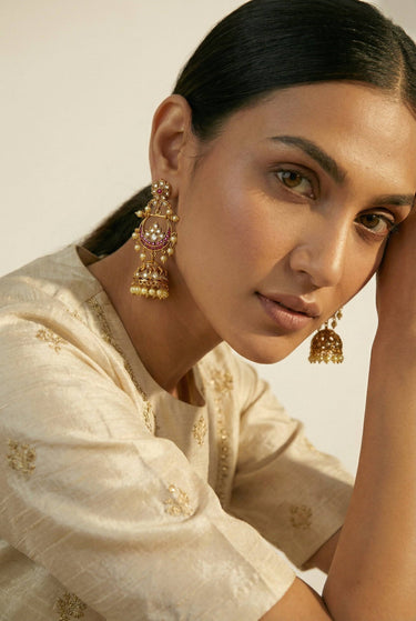 Inaury Saaira Kundan Chandbali Jhumka Earrings styled with cream embroidered kurta — South Asian statement earrings with chandbali crescent and pearl accents