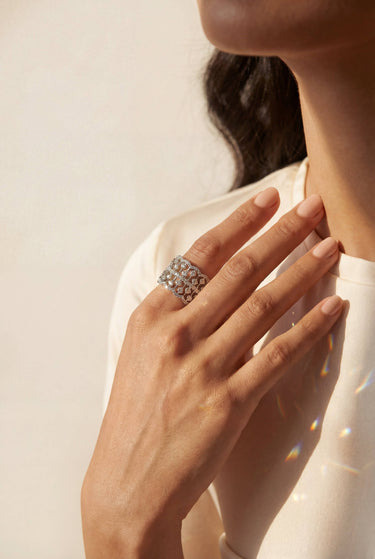 South Asian woman wearing Talia rhoidum plated AD lattice band ring with rainbow sparkle Inaury modern desi jewelry