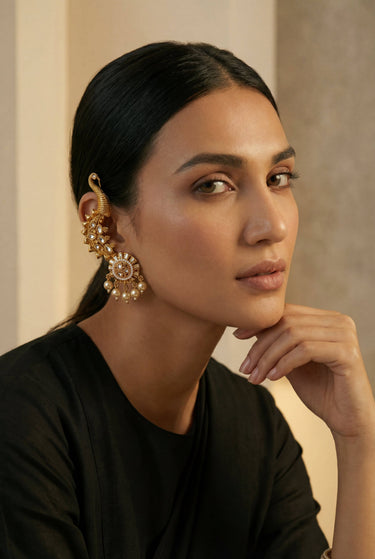 Inaury Tripthi Ear Climbers in Pearl White — gold-plated kundan peacock ear climber with pearl drops styled with black top