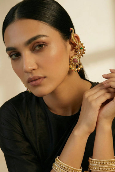 Inaury Tripthi Ear Climber Ruby Emerald — South Asian kundan peacock ear climber jewelry with gemstone detailing styled with black outfit