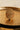 Yasna gold plated AD statement ring front view on gold tray showing open grid pavé dome Inaury desi jewelry