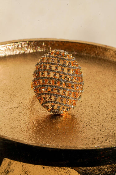 Yasna gold plated AD statement ring front view on gold tray showing open grid pavé dome Inaury desi jewelry