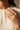 Yasna gold plated AD statement ring closeup on hand showing oversized pavé dome design Inaury