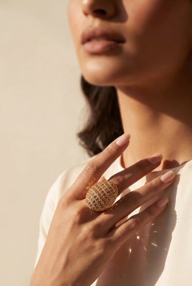 South Asian woman wearing Yasna gold plated AD statement dome ring Inaury contemporary desi jewelry